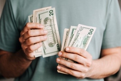 Man Counting Dollars