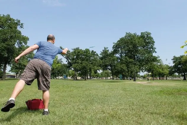 Man Playing Disc Golf Frisbee