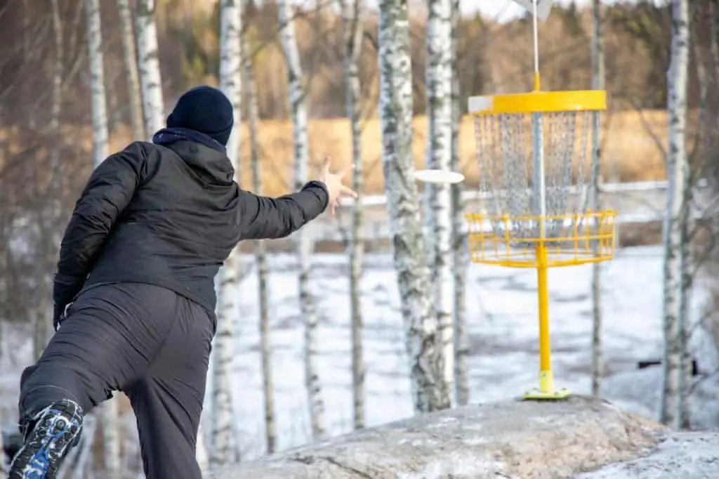 Man Playing Disk Golf in Winters
